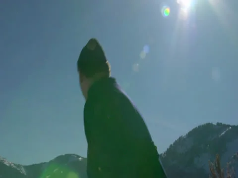 The Boy Plays With Someone by Throwing the Snowball Stock Footage 23085495