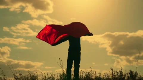 Boy plays superhero in red cape, childhood dream. Happy child playing superhero Video stock 196023948