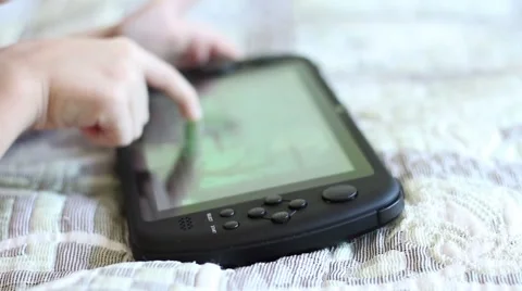 The boy plays the tablet Video stock 60682406