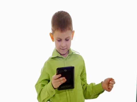 A boy plays on the tablet. Slow motion 스톡 동영상 73774682