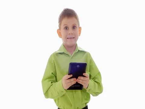 A boy plays on the tablet. Slow motion Stock-Footage 73774716