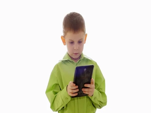 A boy plays on the tablet. Slow motion Video stock 73774726