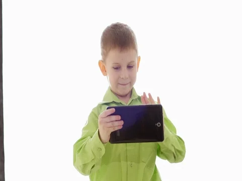 A boy plays on the tablet. Slow motion Stock Footage 73774748