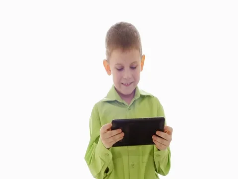 A boy plays on the tablet. Slow motion 스톡 동영상 73774758