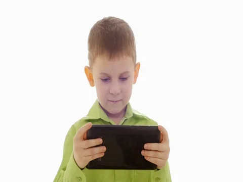 A boy plays on the tablet. Slow motion Vídeo Stock 73774767