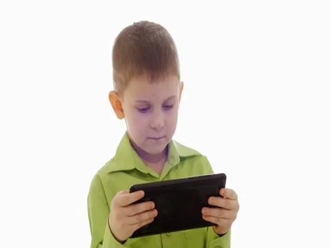 A boy plays on the tablet. Slow motion Stock Footage 73774774