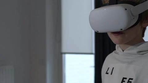 Boy plays with VR goggles slow-motion Stock Footage 146289533