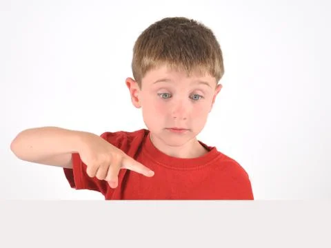 Boy pointing to blank object on white background Stock Photos