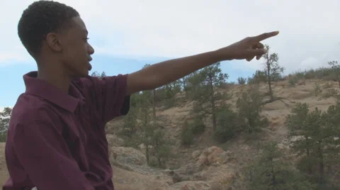 Boy pointing to the horizon. Stock Footage 27338474