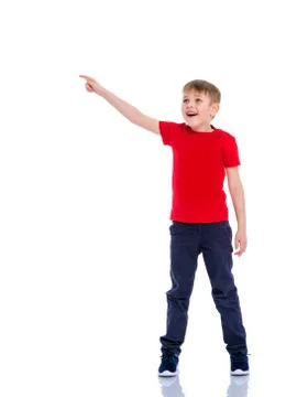 The boy points a finger at something. Stock Photos