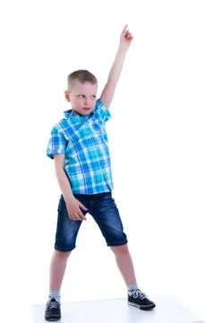 The boy points a finger at something. Stock Photos