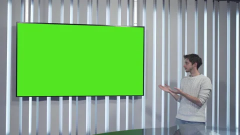 Boy points to the green screen Video stock 144246159