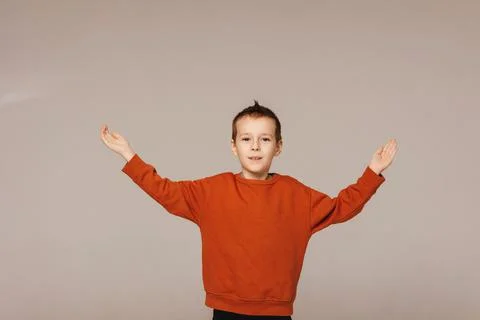 The boy points with his hands to the important. Stock Photos