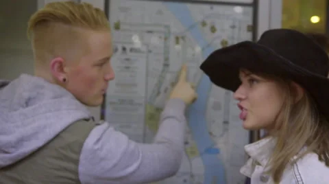 Boy points to where he wants to go on map Video stock 54097288