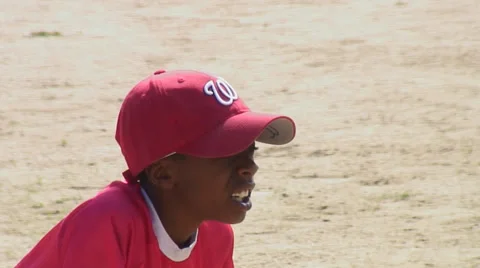 Boy poised to catch  baseball. Stock Footage 27888311