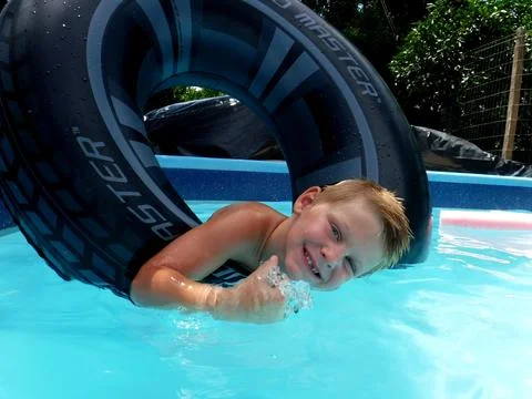 Boy in the pool Stock Photos