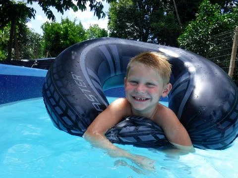 Boy in the pool Stock Photos