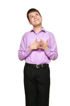 Boy posing on white background, black trousers and purple shirt Stock Photos