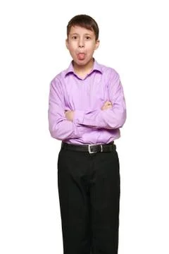 Boy posing on white background, black trousers and purple shirt Stock Photos