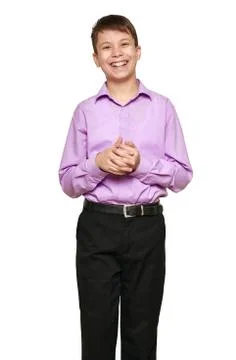 Boy posing on white background, black trousers and purple shirt Stock Photos