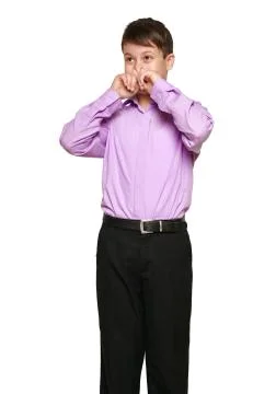Boy posing on white background, black trousers and purple shirt Stock Photos