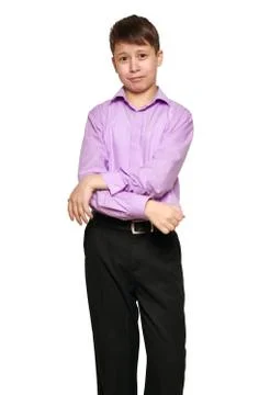 Boy posing on white background, black trousers and purple shirt Stock Photos