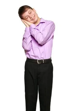 Boy posing on white background, black trousers and purple shirt Stock Photos