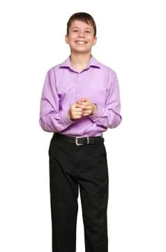 Boy posing on white background, black trousers and purple shirt Foto stock