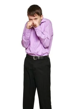 Boy posing on white background, black trousers and purple shirt Stock Photos