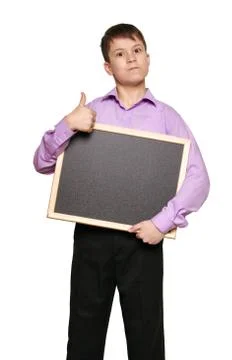 Boy posing on white background, black trousers and purple shirt Stock Photos