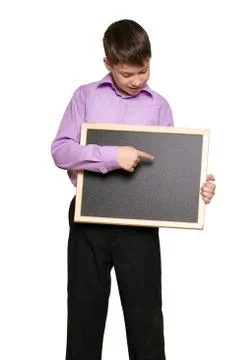 Boy posing on white background, black trousers and purple shirt Stock Photos