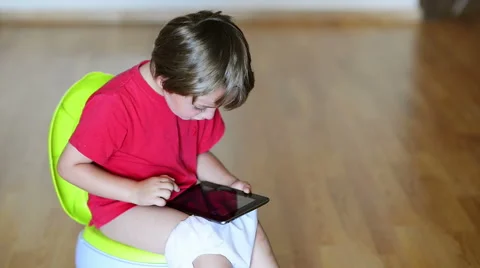 Boy on potty using tablet pc Stock Footage 43534746