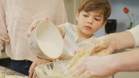 Boy pouring flour Stock Footage 100000901
