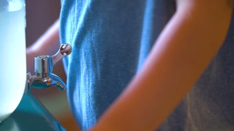Boy Pouring Lemonade for Himself Stock Footage 94396437