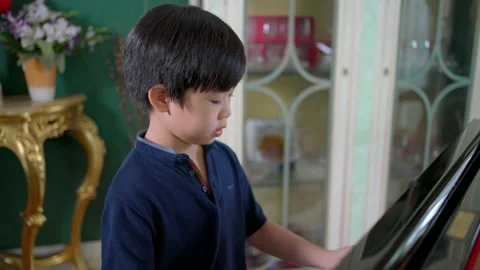 Boy practice piano Stock-Footage 161066961