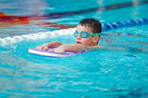 Boy Practice Swimming Stock Photos