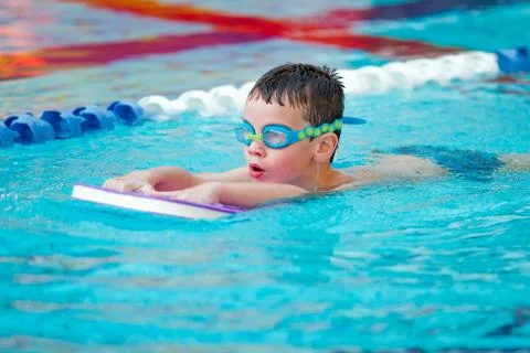 Boy Practice Swimming Stock Photos