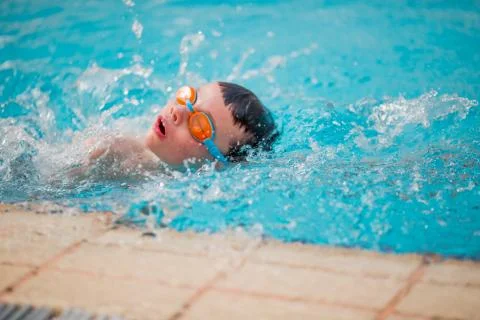Boy Practice Swimming Stock Photos