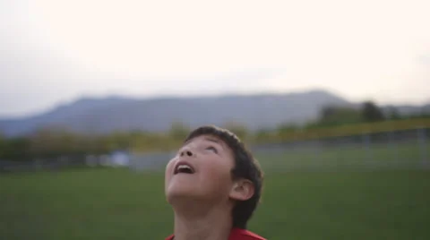 Boy practices heading a soccer ball 動画素材 37408341