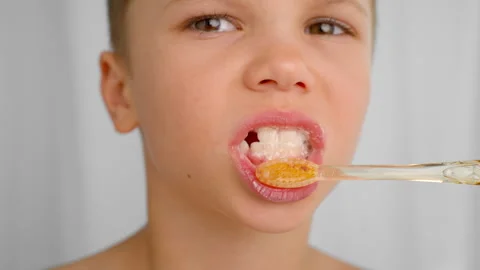 The boy practices oral hygiene every morning and evening. Stock Footage 278510422