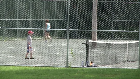 Boy practices returning a tennis serve (2 of 4) Stock Footage 72346181