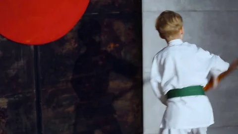 Boy Practicing Aikido Is Training With Bokken Sword Stock Footage 76209267