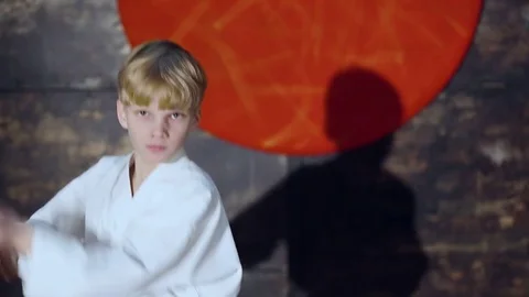 Boy Practicing Aikido Is Training With Bokken Sword Stock Footage 76209272