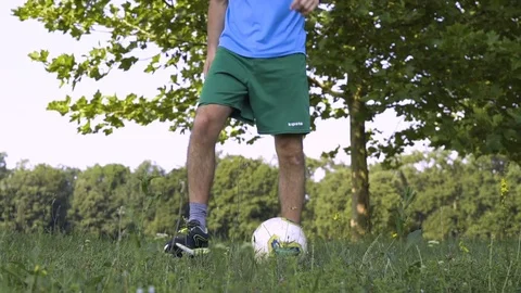 Boy Practicing with Soccer Ball Stock Footage 83159996