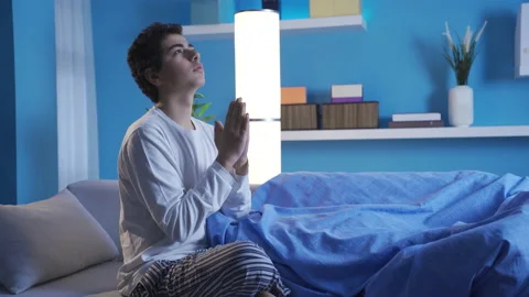 Boy praying to god at night. Stock-Footage 234099528