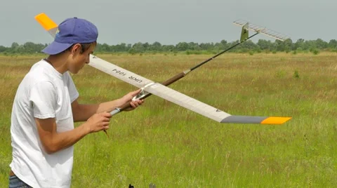 Boy Preparing Airplane to Launch at Competition Outdoors Konotop Ukraine Kids' 動画素材 64580497