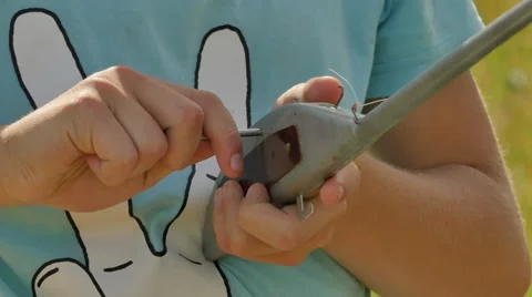 Boy is Preparing a Fuselage of Aicraft Model Sports Competition Preperation to Stock Footage 64580613
