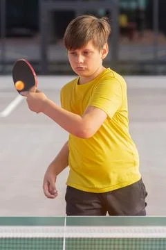 Boy Preparing to Return in Table Tennis Vertical Stockfoto's