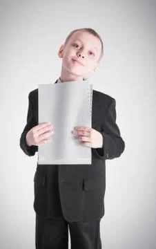 Boy presses the stack of paper Stock Photos
