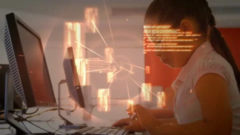 Boy pressing keys, typing commands in tech lab, forming orange data blocks Stock Footage 313724739